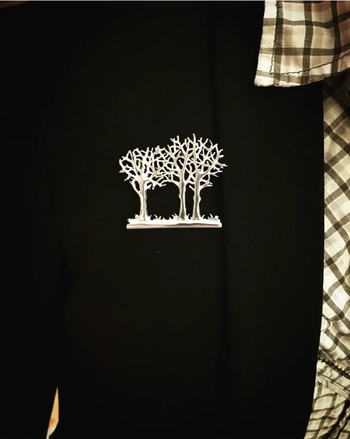 Tree Brooch, featuring a small bird flying from its branches